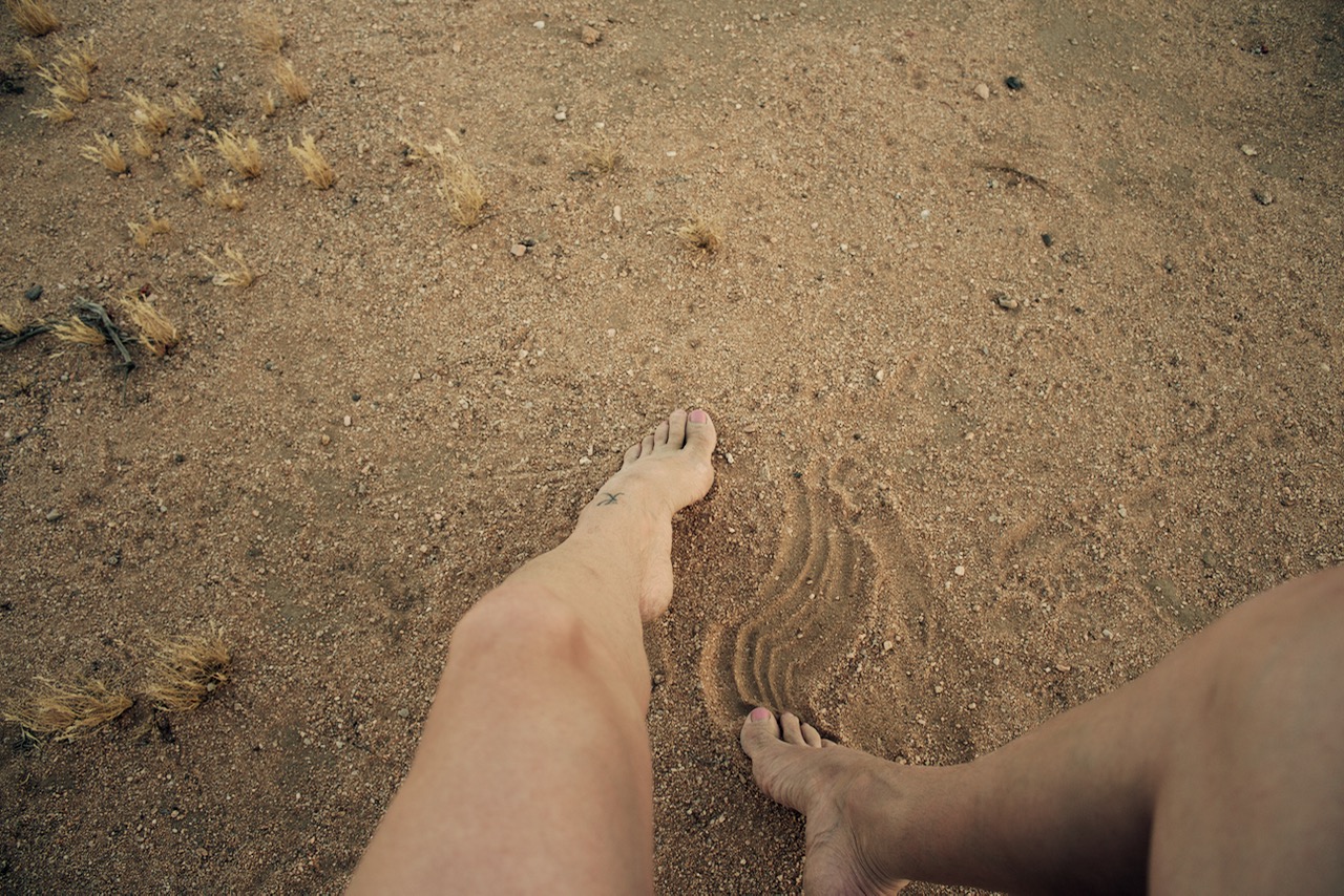 feet in the sand desert