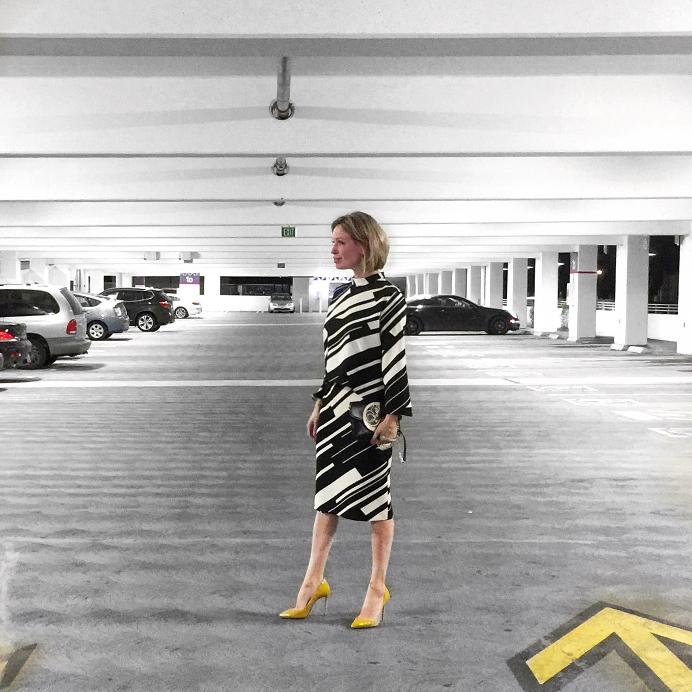Black and white blouse and matching skirt from Zara with yellow Christian Louboutin shoes