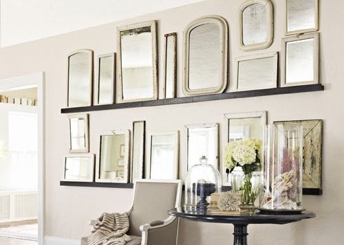 A gallery wall made out of vintage mirrors