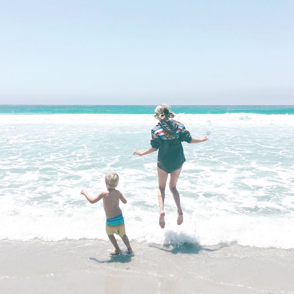 Jordan Reid and son at the beach in California